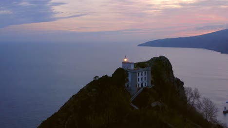 aerial-orbit-of-lighthouse-at-harbor-entrance