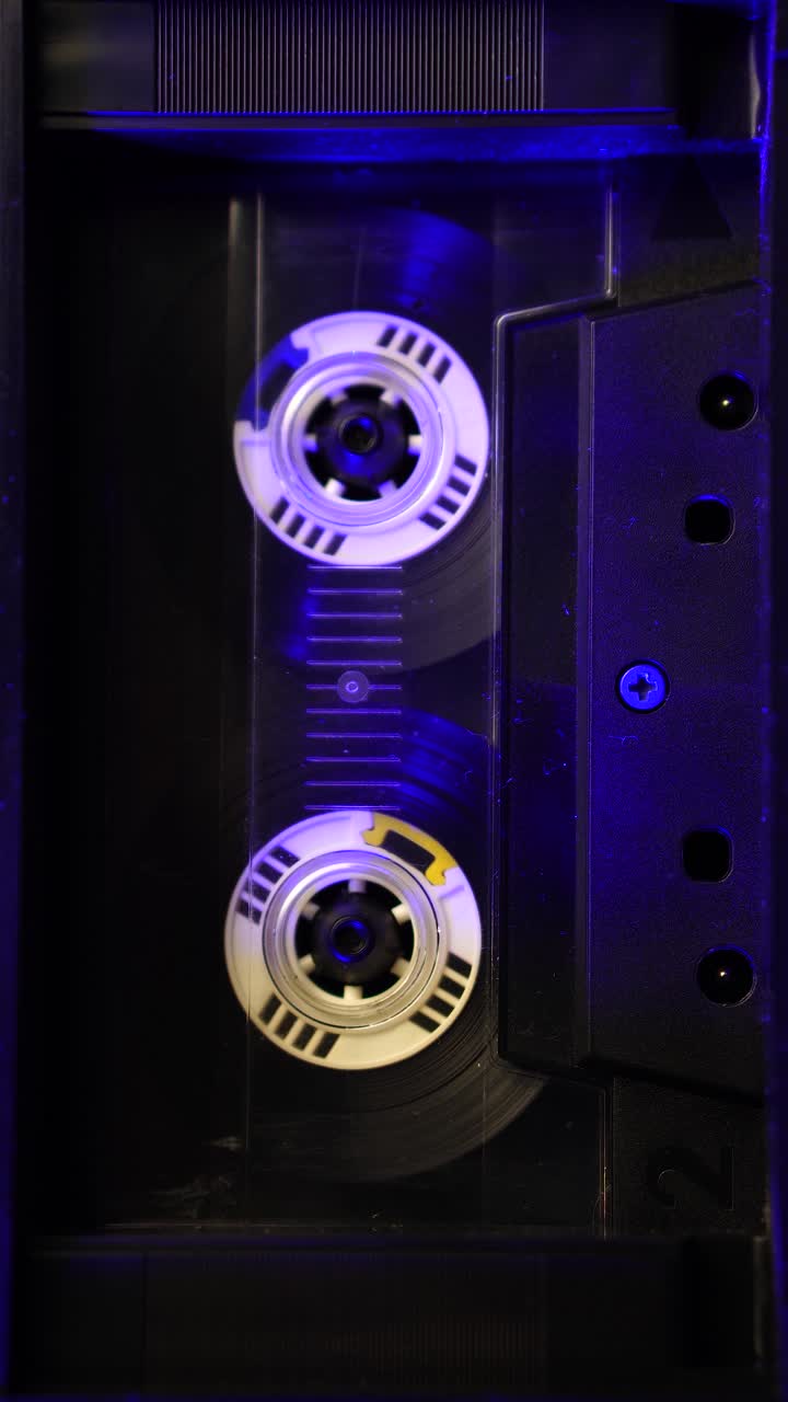 Vertical 4k, Vintage Audio Cassette Tape Spinning During Playback or Recording