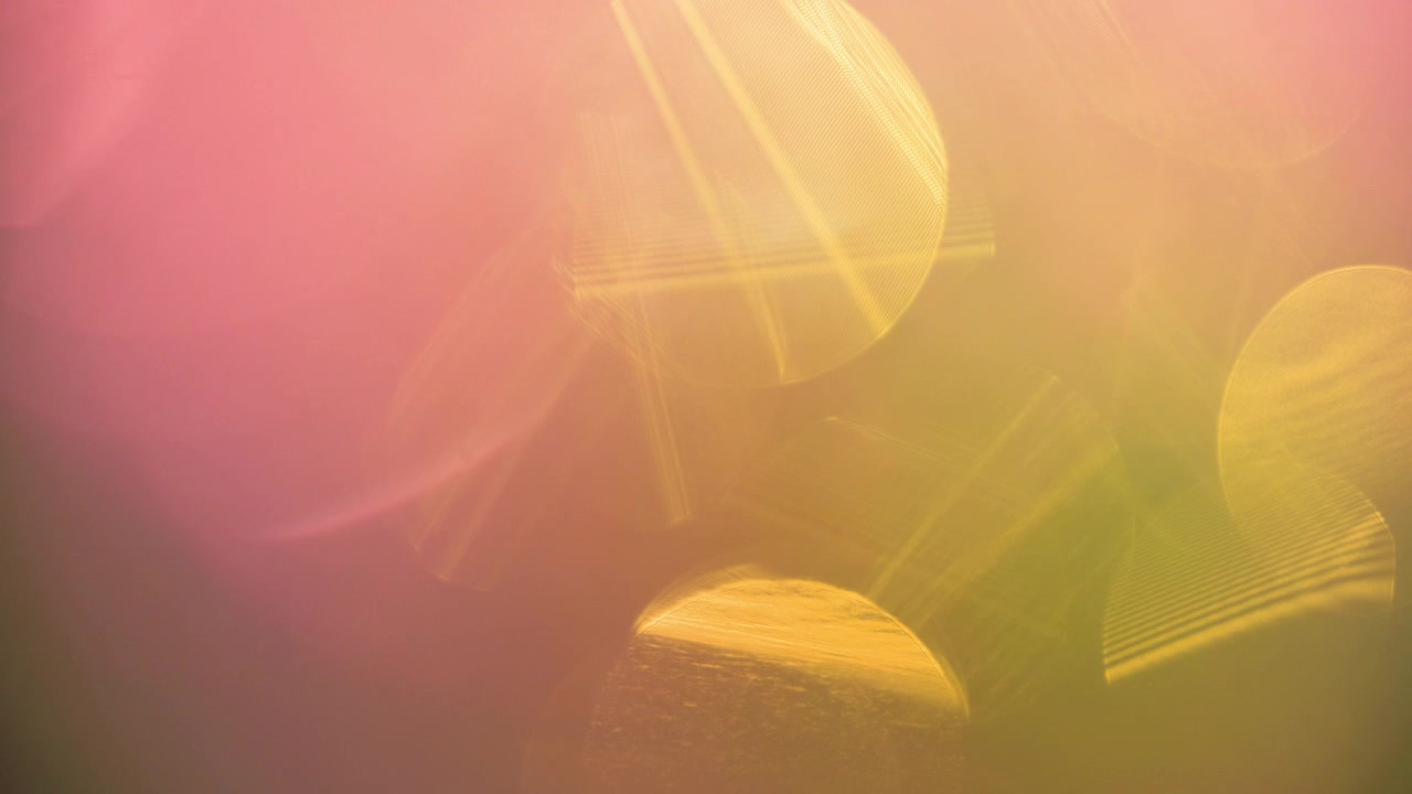 Abstract Colorful Light Leaks and Bokeh Transitioning on Black Background