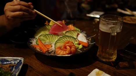 sashimi platter with beer at a japanese restaurant