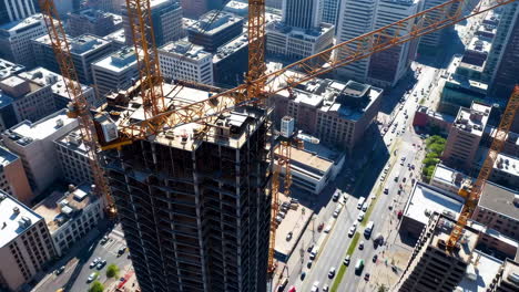 construction of a skyscraper in a busy urban area