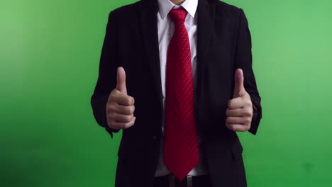 businessman showing thumbs up on green screen, video in 4k