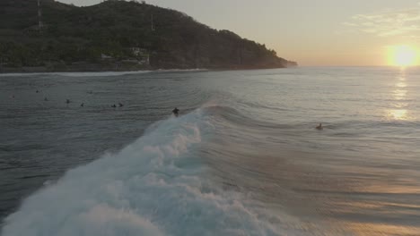 Aerial-Drone-view-of-surfers-at-Sunrise-El-Zonte-El-Salvador