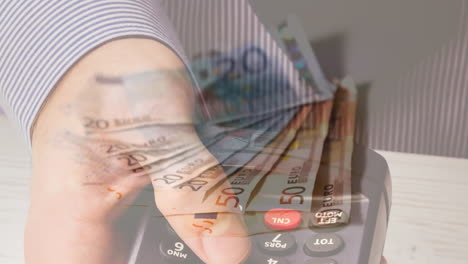 animation of euro banknotes falling over hand of caucasian man holding payment terminal