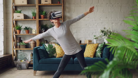 woman practicing yoga with vr headset at home
