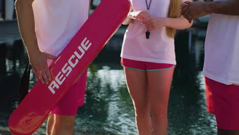 lifeguard team talking at the swimming pool