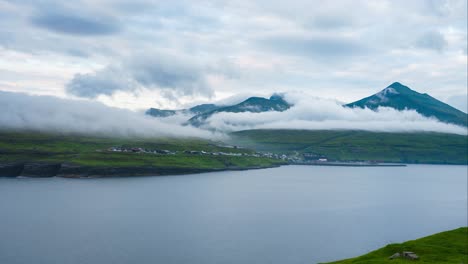 Remote-green-faroe-island-mountains-with-passing-clouds-timelapse