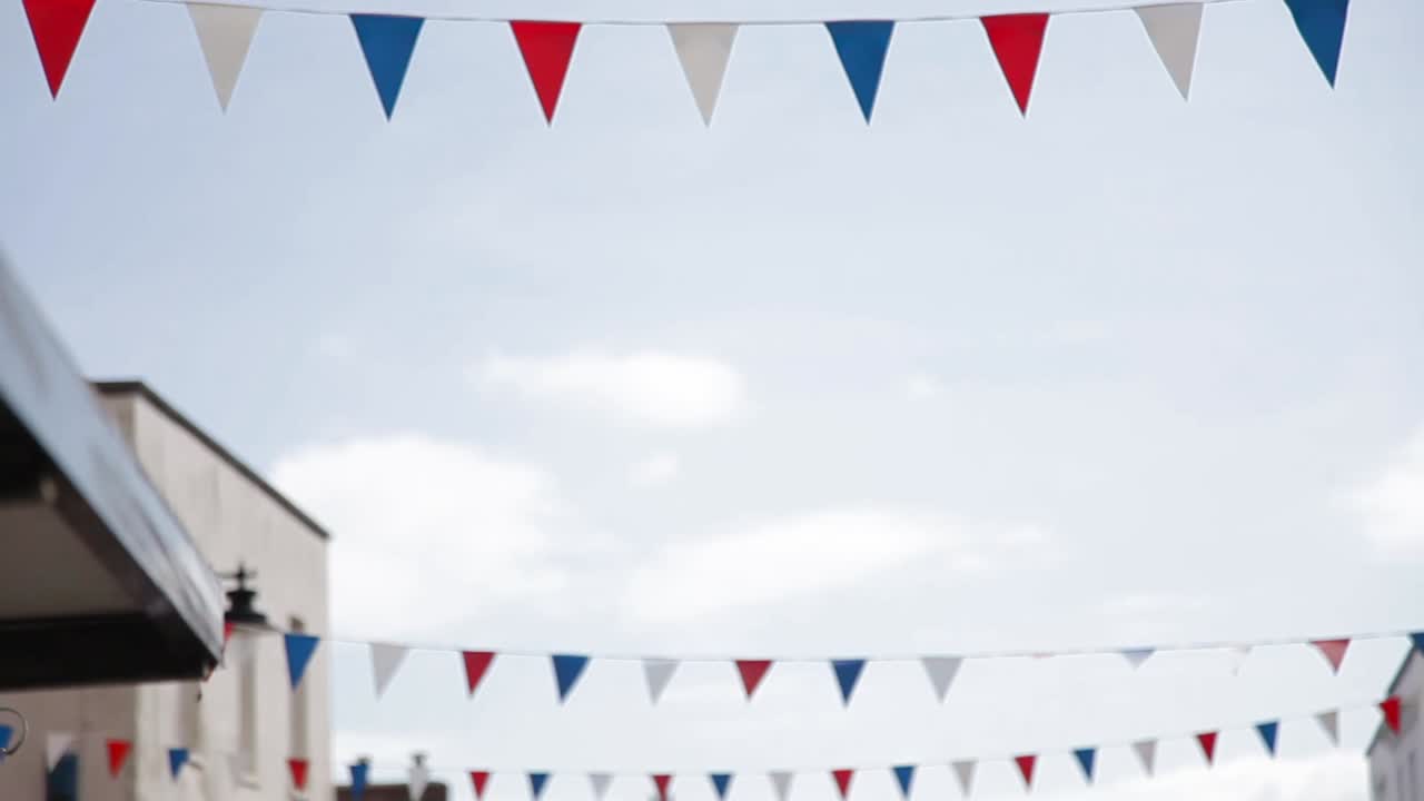 Color flags in a small town, Jurassic coast of England, static shot