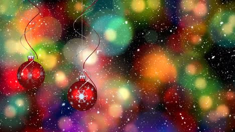 Animation-of-snow-falling-over-christmas-baubles