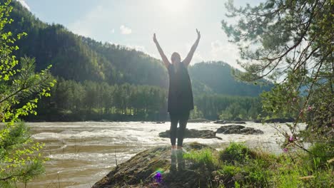 woman enjoying nature by a river