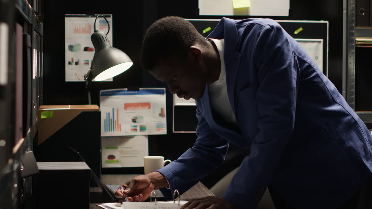 Businessman working on laptop in office