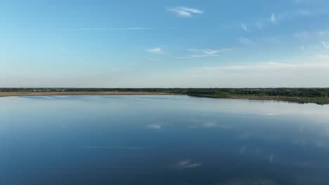 Aeria-view-of-Osadnik-Gajówka-artificial-lake-in-Gmina-Przykona,-within-Turek-County,-Greater-Poland-Voivodeship,-Poland