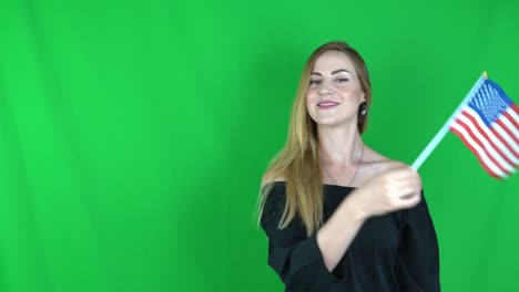 blonde woman waving in front of united states flag green screen,