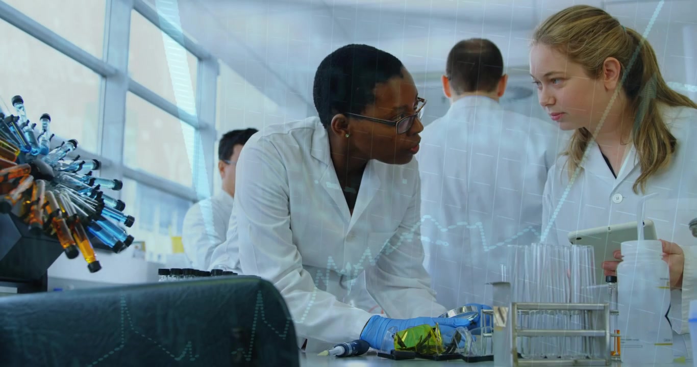 Lab team handling green packet for test, leaning in consulting, tablet labels highlighting pipettes