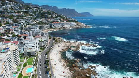 coastal hillside skyline of sea point in cape town south africa on sunny summer day, aerial