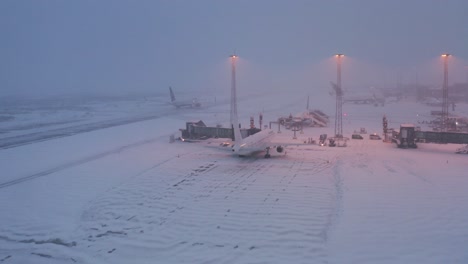 chilling winter conditions at keflavik airport with snow covered tarmac