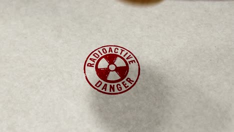 radioactive danger symbol stamp and stamping loop animation