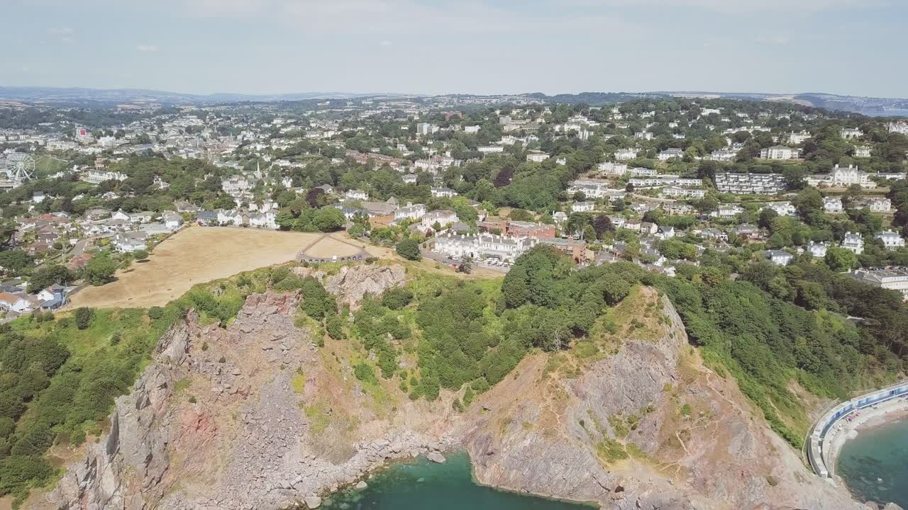 Aerial View of Coastal Town with Cliffs and Buildings
