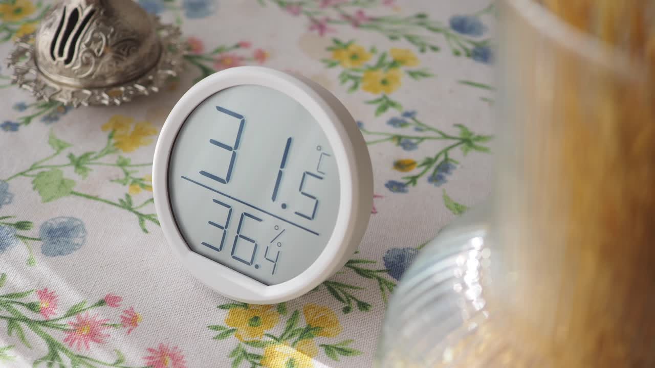 Digital Thermometer and Hygrometer on a Table