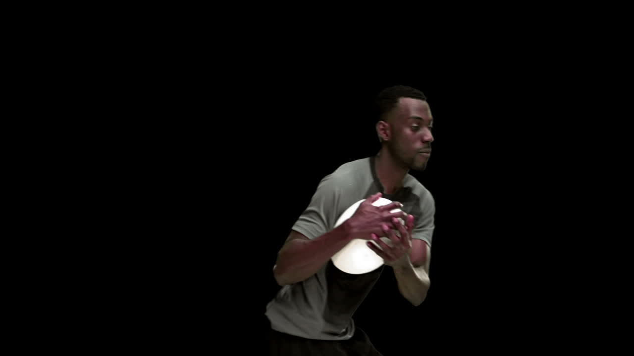 Serious rugby player playing in slow motion