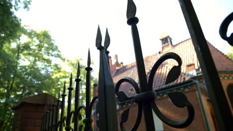 Church,-iron-fence-with-sharp-pointed-spikes-in-the-light-of-sunlight