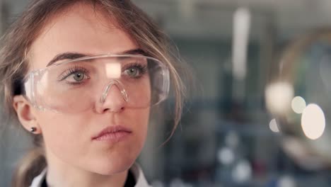 closeup-portrait-of-doctor-scientist-with-magnifier-looking-carefully