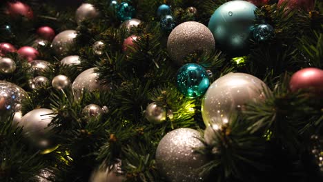 close-up of the beautiful multicolored christmas balls hanging on the fur-tree and christmas lights. concept. colorful decoration of christmas tree