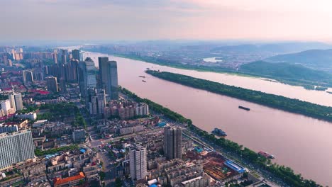 Drone-shot-view-of-orange-island-park-and-surrounding-cityscape-at-Changsha-city,-Hunan,-China