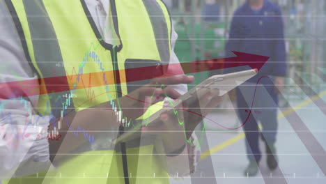 woman wearing safety vest tapping tablet in factory, overlaying financial charts and red arrow