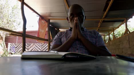 stressed african male reading during corona