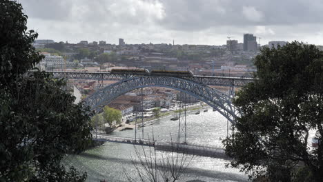 public tram on the dom luis i bridge in porto, static cityscape