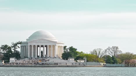 An-airplane-landing-behind-the-Jefferson-Memorial-during-the-Cherry-Blossom-Festival