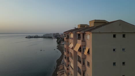 drone shots reveal la manga's stunning beachline, capturing the vibrant seaside, striking buildings, and the breathtaking coastal scenery along the mediterranean shoreline.
