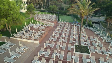 aerial shot of poolside sun loungers in mallorca, spain