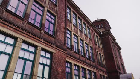 shot of the windows and façade of the art nouveau school building in ostrava vítkovice