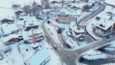 zooming out shot of snowy kandersteg town in winter, switzerland