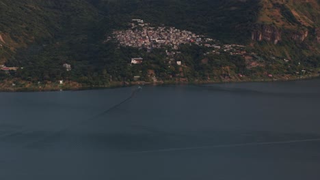 tilt up shot of san marcos at lake atitlan guatemala during sunrise, aerial