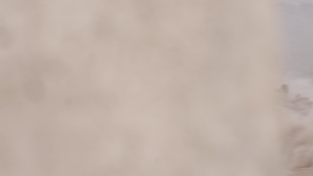 An army battle tank at the border of Gaza, Armoured combat fighting vehicle moving in sand and dust during Israel&ndash;Hamas war conflict 2023