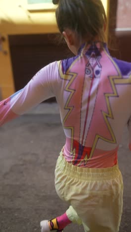 stylish woman in colorful outfit on city street