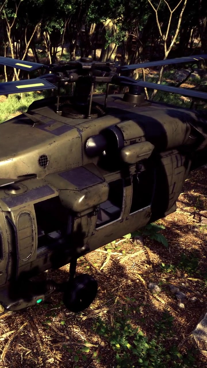 Military helicopter on the ground in a forest area during daytime