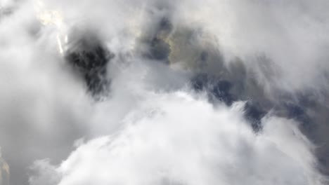 thick, moving, white cumulonimbus clouds, a thunderstorm