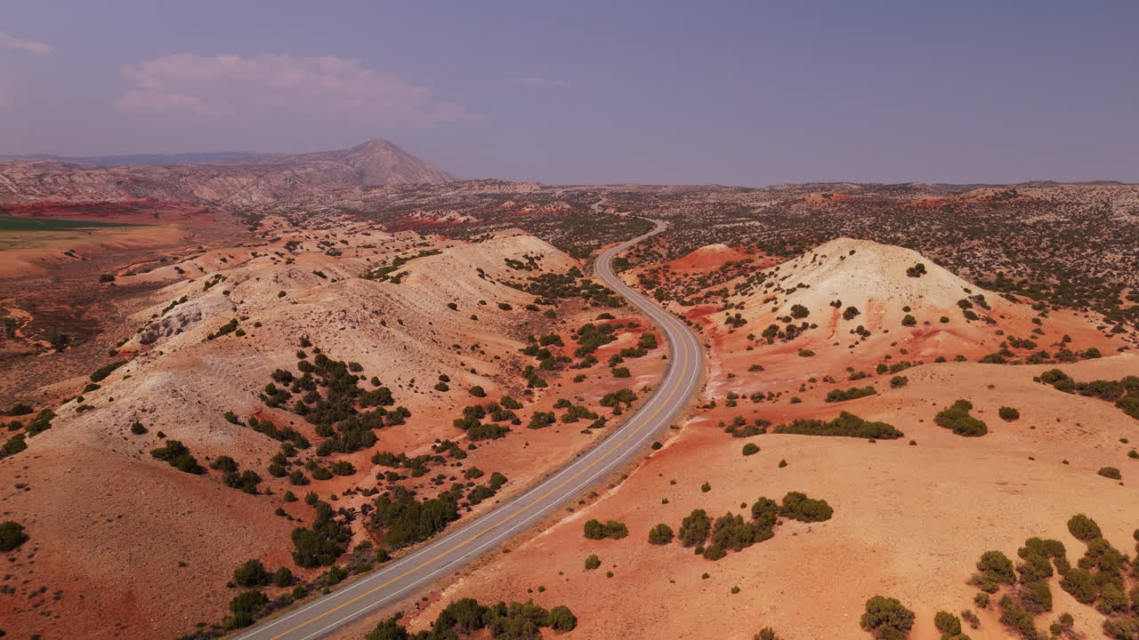 Scenic Highway Through Colorful Desert Landscape