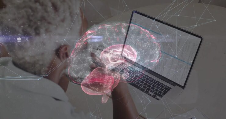 Professional typing on laptop starting rotating brain hologram with pulsing network mesh technology