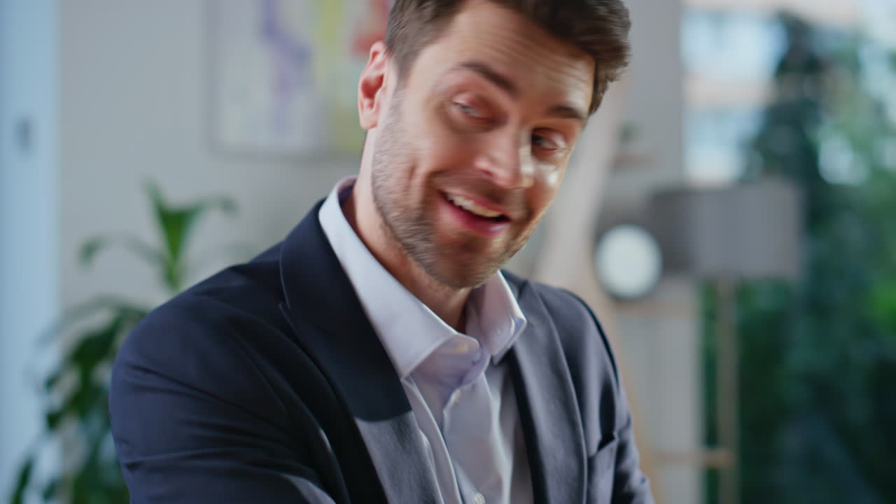 Businessman presenting project laptop talking to woman client in office closeup