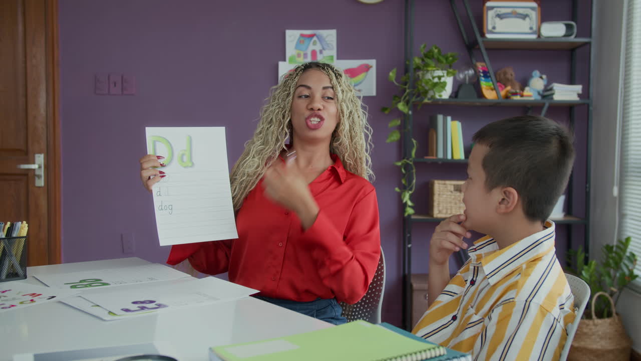 Tutor and Schoolboy Having Speech Therapy Class