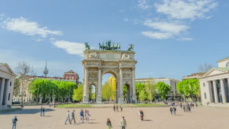 tourists visit arch of peace in historical center of milan