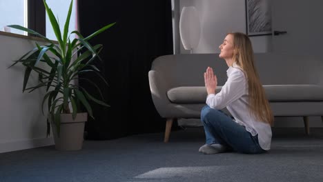 european mother doing yoga while her little daughter runs and jumps yoga classes exercises at home european mother doing yoga while her little daughter runs and jumps yoga classes exercises at home healthy lifestyle