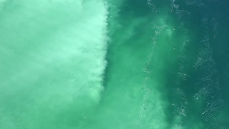 slow flight over the edge of massive herring spawn, clearly visible