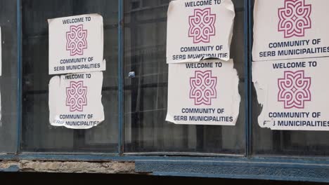 Posters-of-the-community-of-Serb-municipalities-in-Mitrovica,-Kosovo