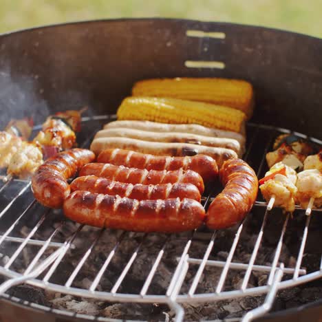 Sausages--corncobs-and-kebabs-grilling-on-a-BBQ